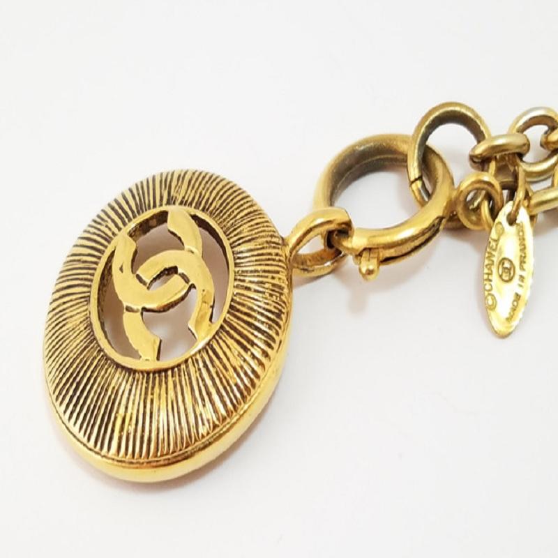 Chanel Gold-tone Metal CC Logo Cutout Sunburst Pendant Necklace In Good Condition For Sale In Irvine, CA