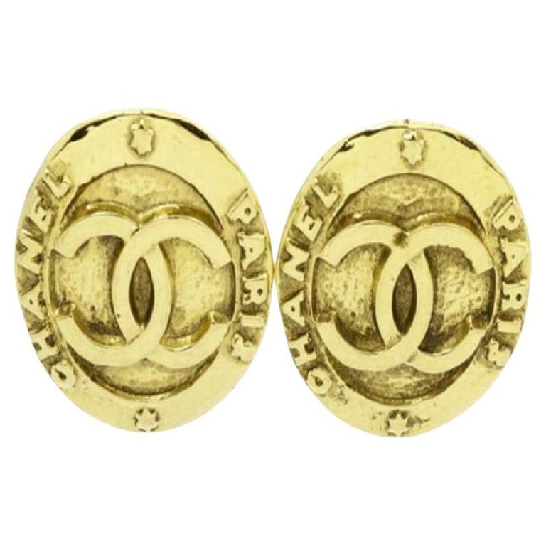 Vintage CHANEL gold tone round earrings with large CC mark at