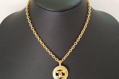 Chanel Gold-tone Metal CC Logo Sunburst Pendant Necklace