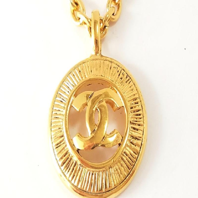 Chanel Gold-Tone Metal CC Logo Sunburst Pendant Necklace In Good Condition In Irvine, CA