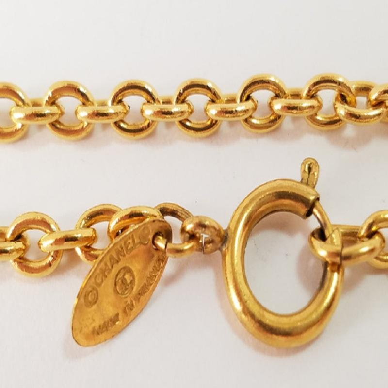 Women's Chanel Gold-Tone Metal CC Logo Sunburst Pendant Necklace