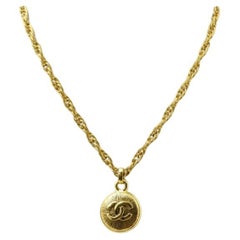 Chanel Gold-tone Metal CC Logo Sunburst Pendant Necklace