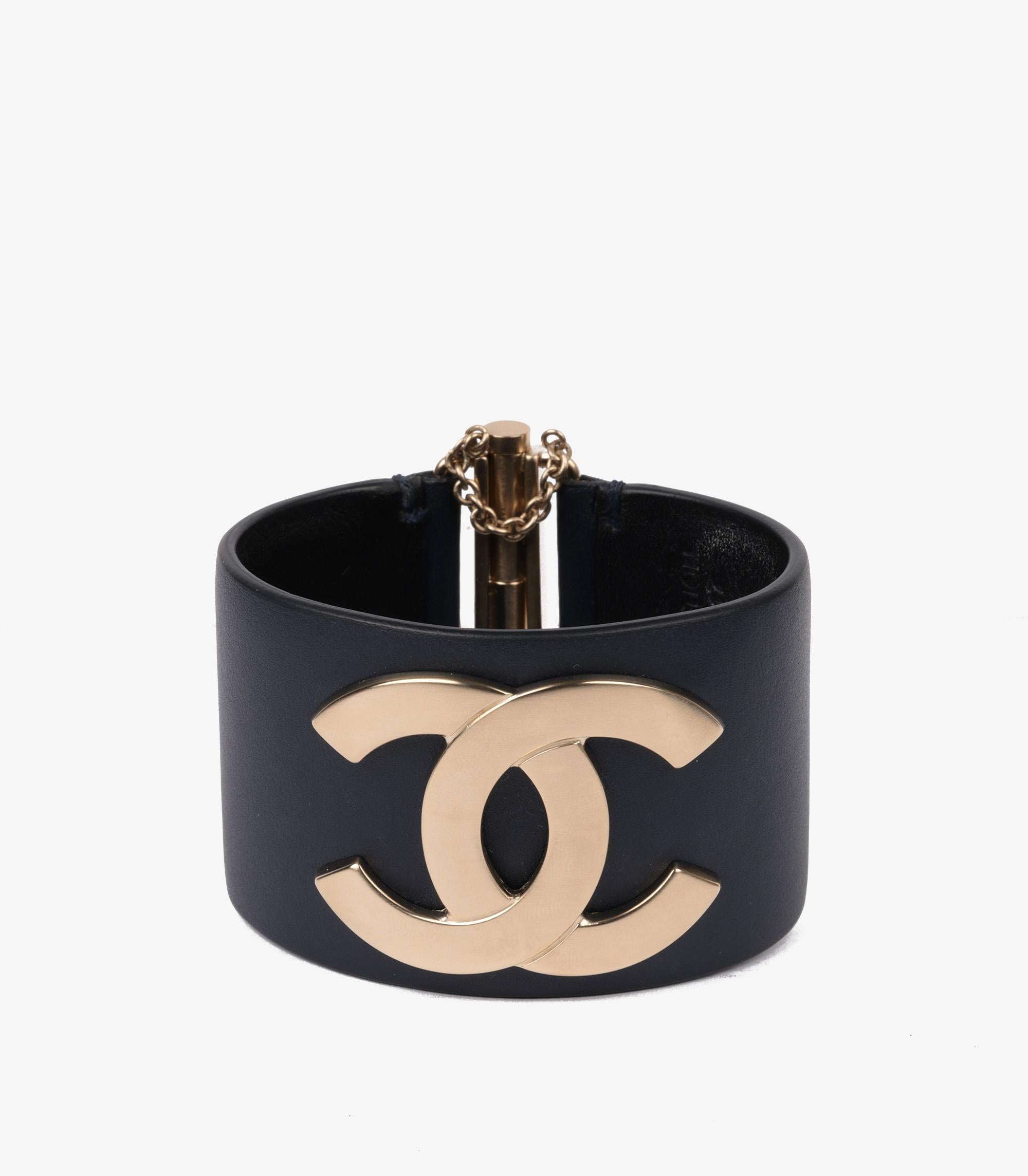 Chanel Gold Tone Navy Lambskin Leather CC Bracelet

Brand- Chanel
Model- Leather CC Bracelet
Product Type- Bracelet
Serial Number- 20**
Accompanied By- Chanel Box
Material(s)- Gold Tone Metal

Gemstone Quantity- 58.6g
Bracelet Length-