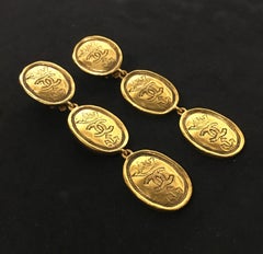 Chanel Gold Tone Oval Dangle Crown CC Logo Clip Earrings ‘26‘ 1987 / 1989