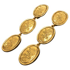 Vintage Chanel Gold Tone Oval Dangle Crown CC Logo Clip Earrings ‘26‘ 1987 / 1989