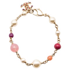 Chanel Gold Tone Pink Beaded CC Charm Bracelet
