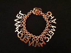 Chanel Gold Toned Letters Turnlock Chain Bracelet