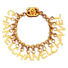 Chanel Gold Toned Letters Turnlock Chain Bracelet 