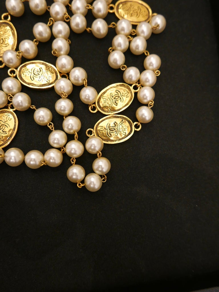 Vintage CHANEL Gold Toned Medallion Faux Pearl Long Chain Necklace at