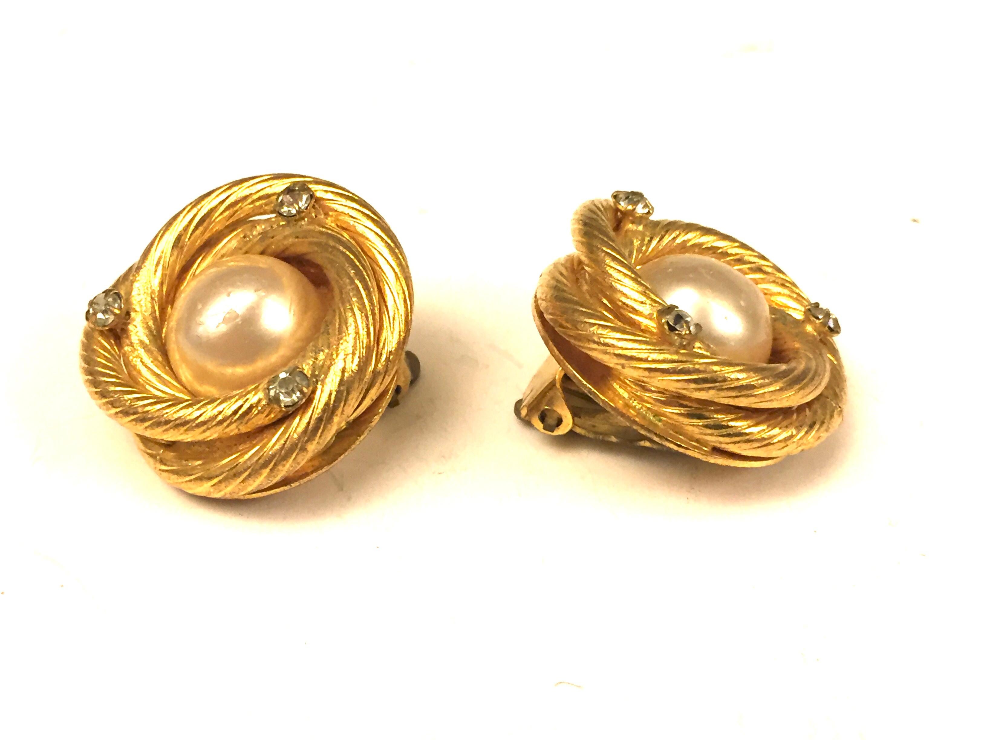 - Vintage gold toned pearl/rhinestones clip on earrings. 

-Measurement: 2.5 diameter. 

- Collection 29 is Made in between 1984-1990. 

- Please note that this vintage item is not new, so it might have minor imperfection. 