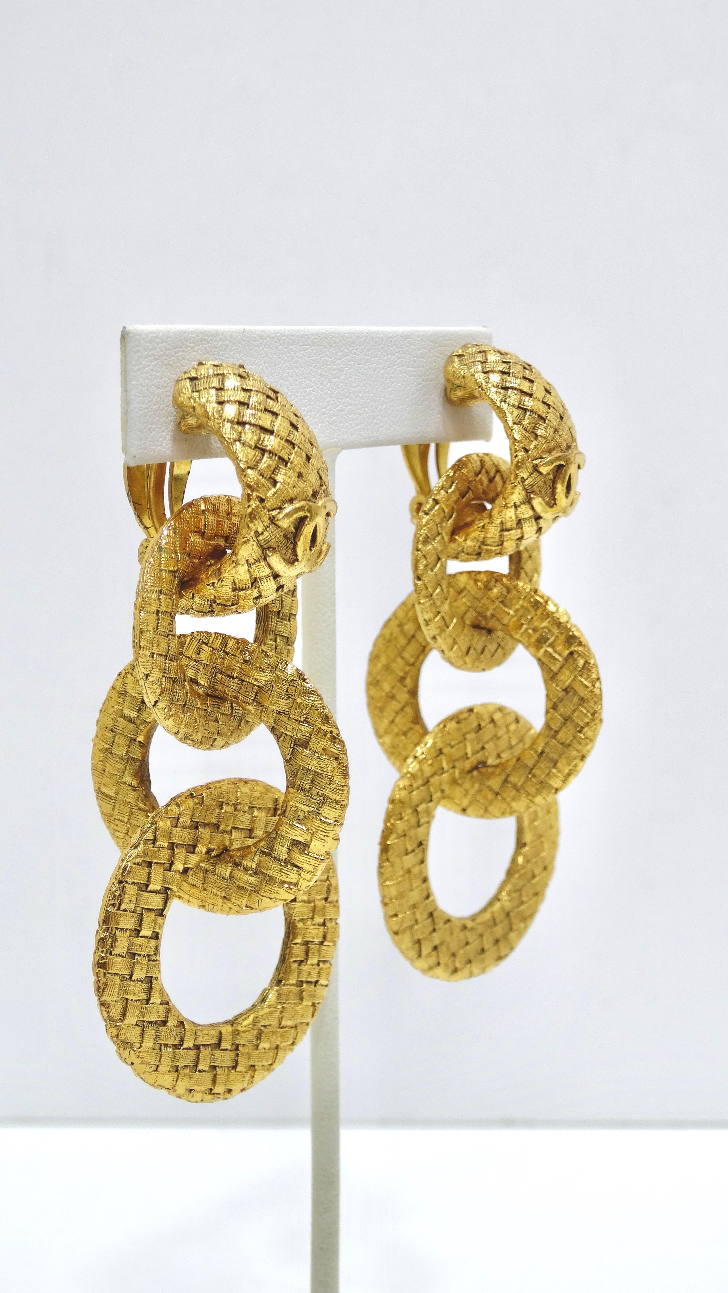 What's better than vintage Chanel? Get your hands on these unique vintage earrings from collection number 29 dating back to the 1990's. They are featured in gold-plating, clip-on back, three round shape interlocked to make the length, woven