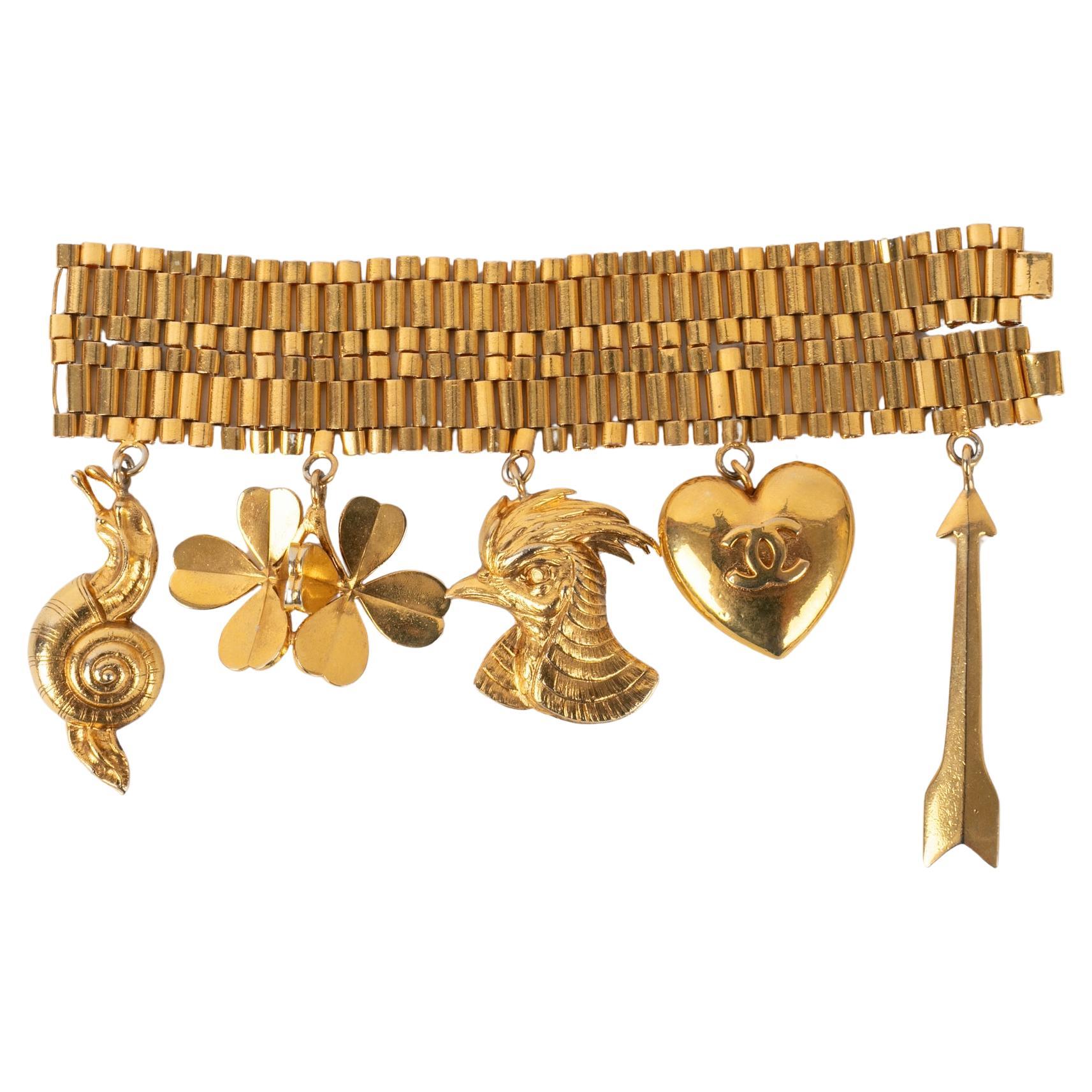 Chanel Golden Metal Bracelet Ornamented with Charms