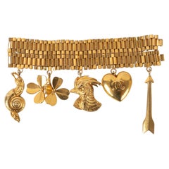 Chanel Golden Metal Bracelet Ornamented with Charms