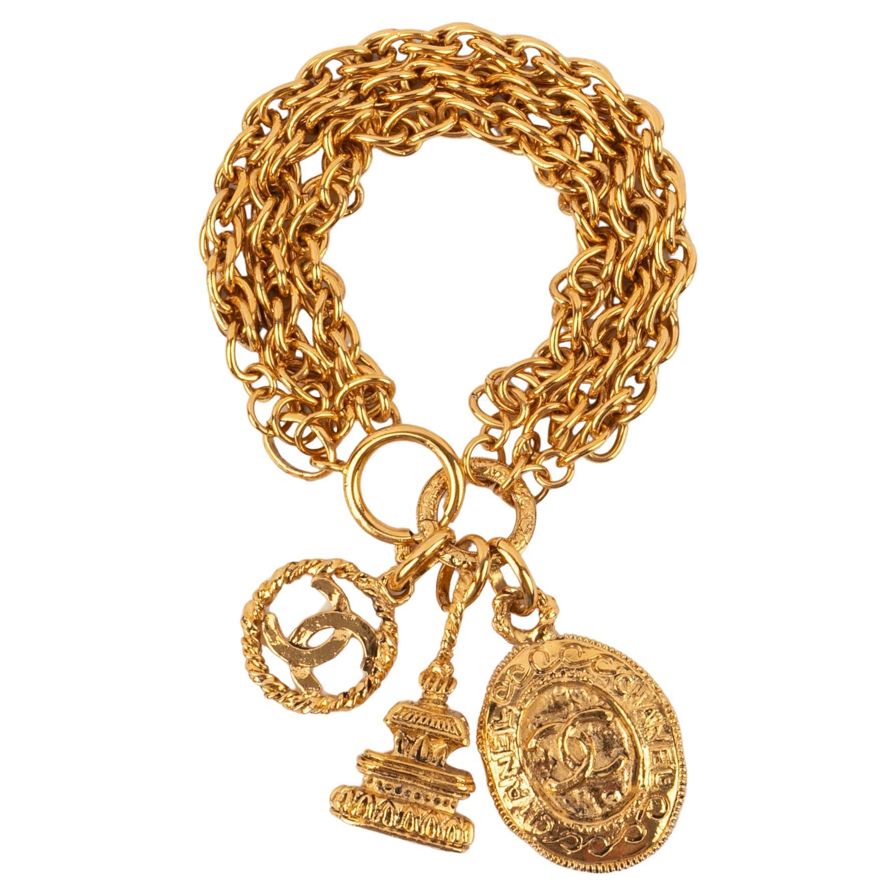 Chanel Golden Metal Bracelet with Charms, 1980s For Sale