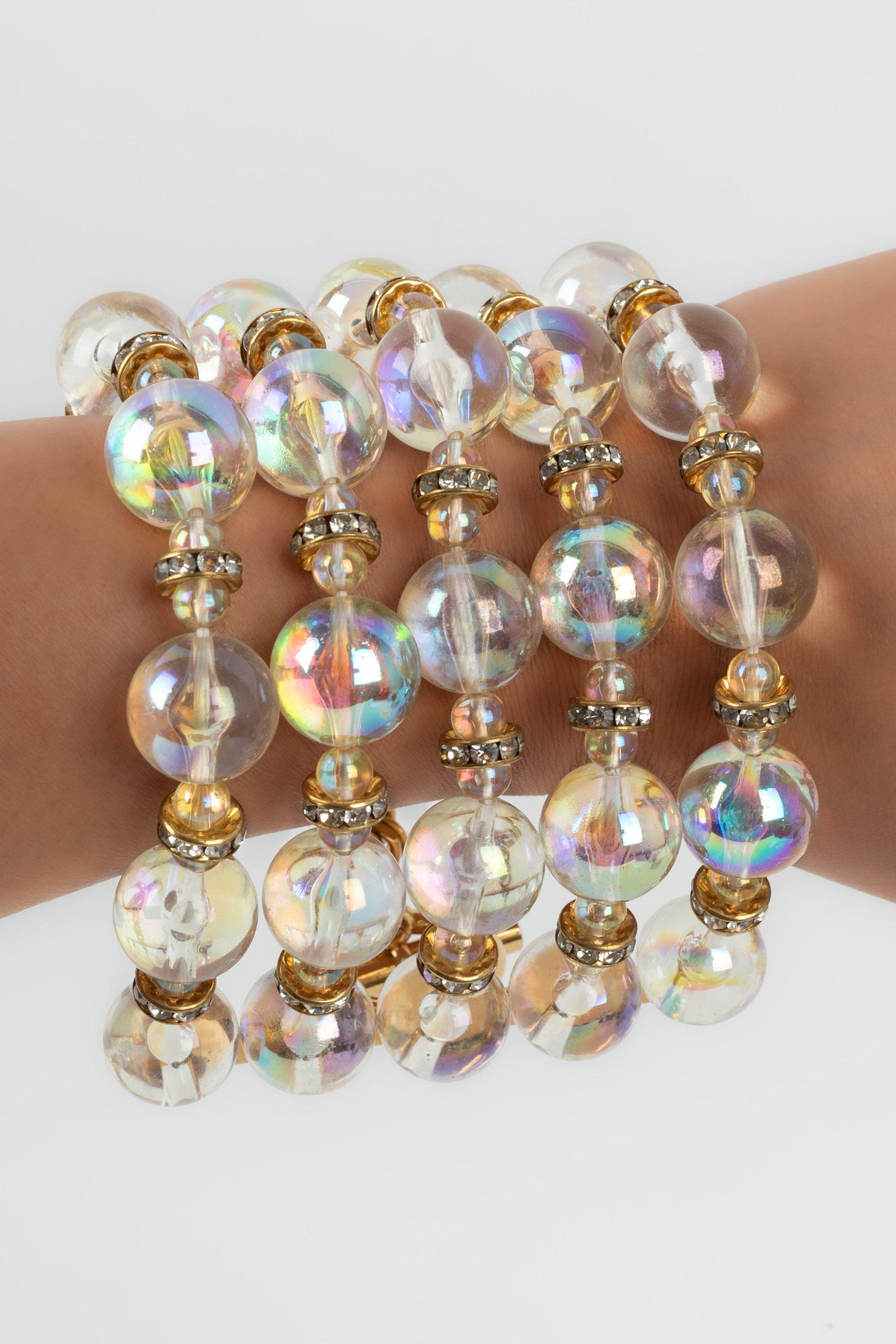 Chanel -(Made in France) Golden metal bracelet with rhinestone circles and transparent pearls. 2cc8 Collection.

Additional information:
Condition: Very good condition
Dimensions: Length: 23 cm

Seller Reference: BRAB54
