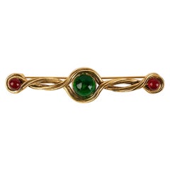 Chanel Broche en métal doré et cabochons de pâte de verre