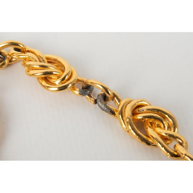 Chanel Sautoir en métal doré avec nœuds en vente 3