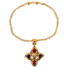 Chanel Golden Metal Necklace with a Blue and Red Glass Paste Pendant, 1997