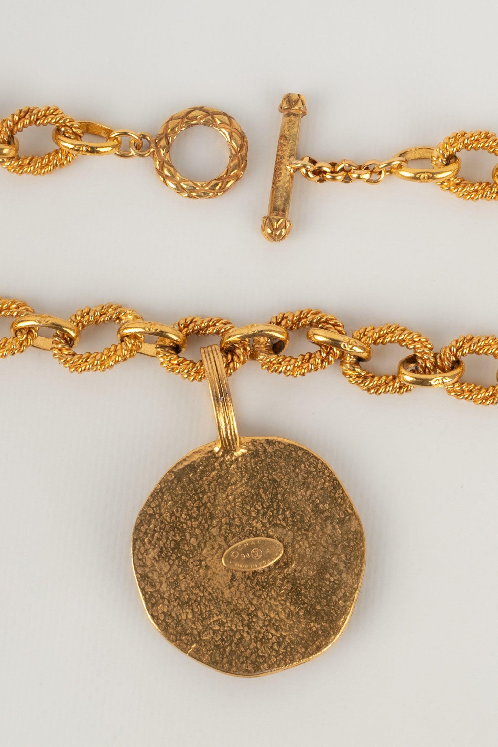 Chanel Golden Metal Necklace with a Sun Pendant, 1993 For Sale 1