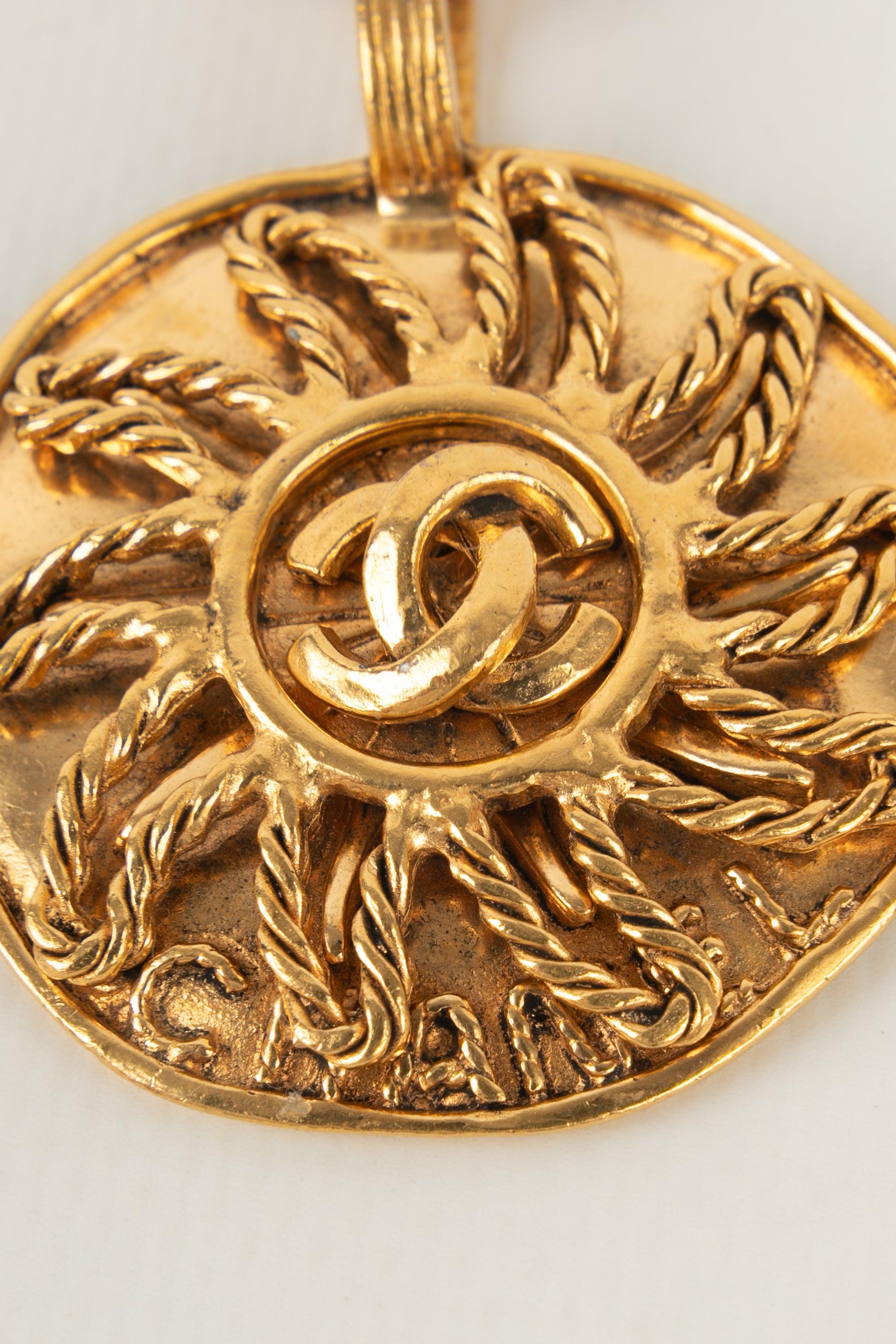 Chanel Golden Metal Necklace with a Sun Pendant, 1993 For Sale 2