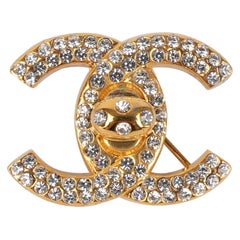 Vintage Chanel Golden Metal Turnlock Brooch Ornamented With Swarovski Rhinestones, 1996