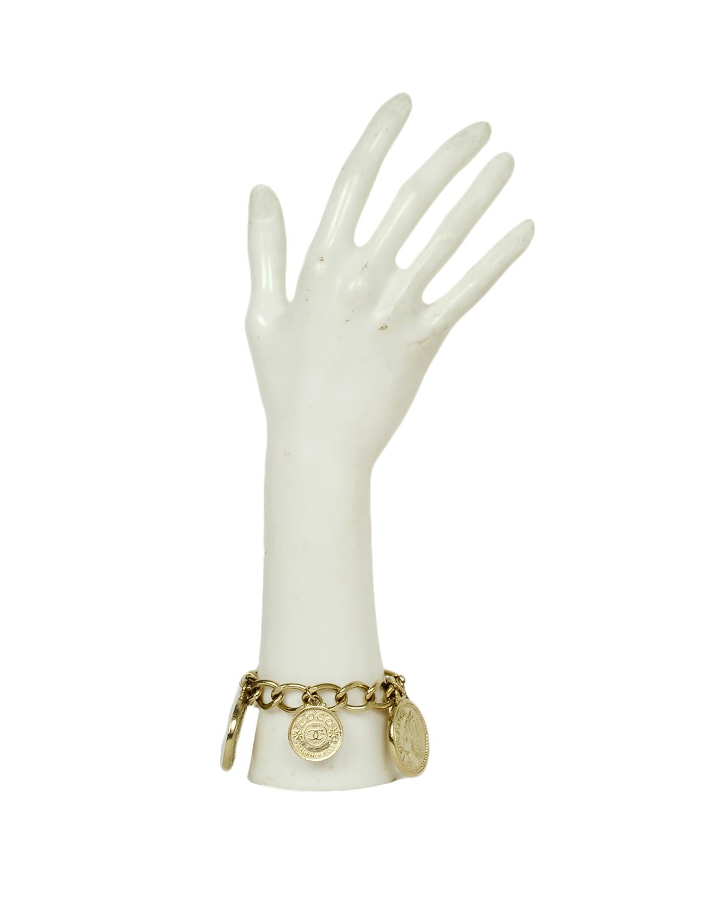 Chanel Goldtone Coco Coin Charm Chainlink Bracelet

Made In: France
Year of Production: 2006
Color: Goldtone
Materials: Metal
Hallmarks: 