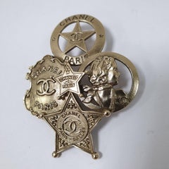 Chanel Goldtone Paris-Dallas CC Badge Brooch Pin