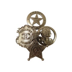 Chanel Goldtone Paris-Dallas CC Badge Brooch Pin
