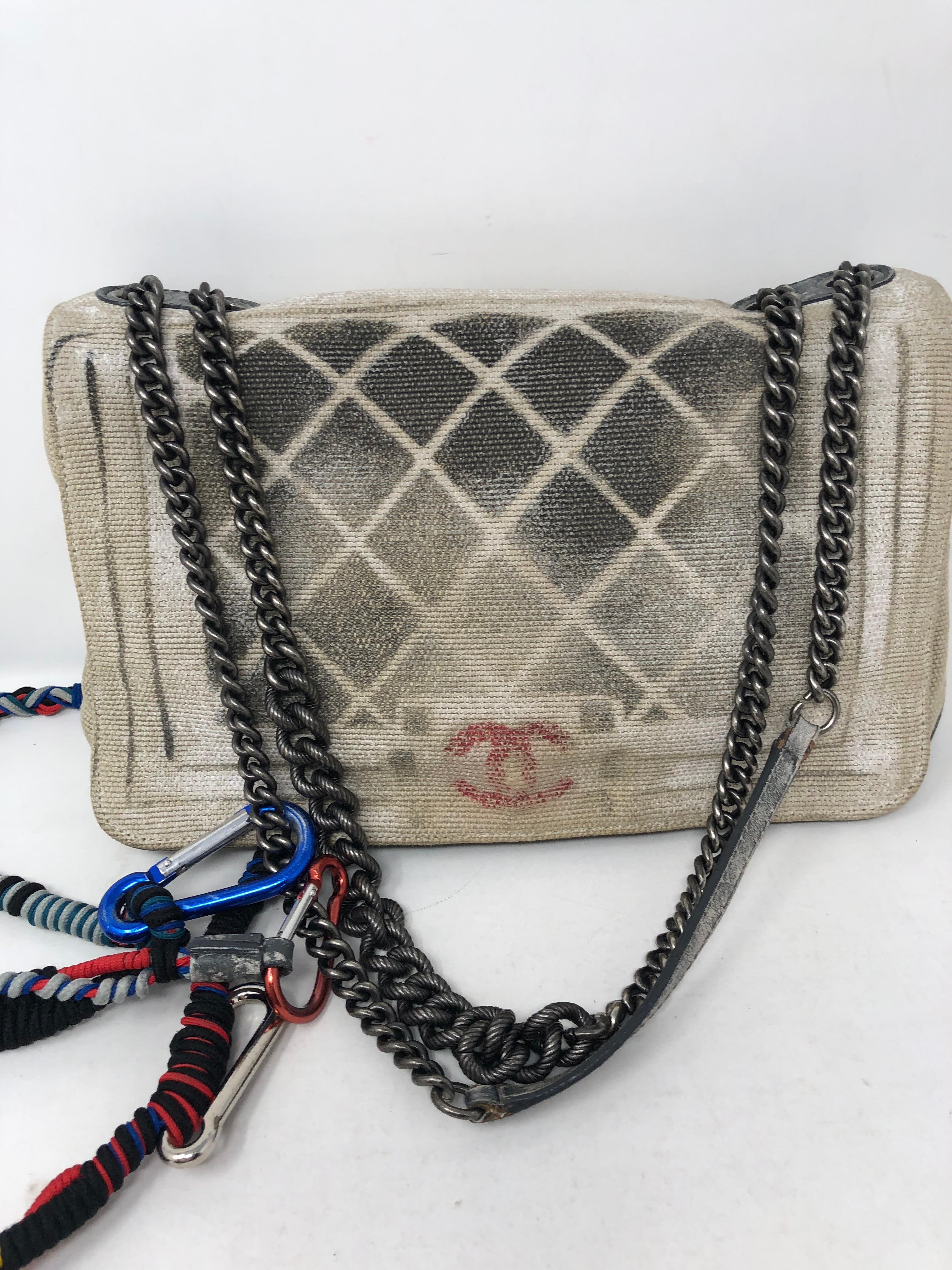 Chanel Graffiti Crossbody Bag. Runway and rare Chanel Canvas Bag with chain shoulder straps. And nylon multicolor strap. Can be worn as a crossbody or a shoulder bag.