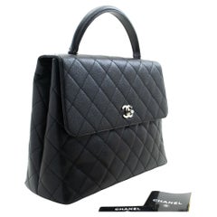 CHANEL Handtasche aus genarbtem Kalbsleder Kelly mit Griff oben und schwarzer Klappe