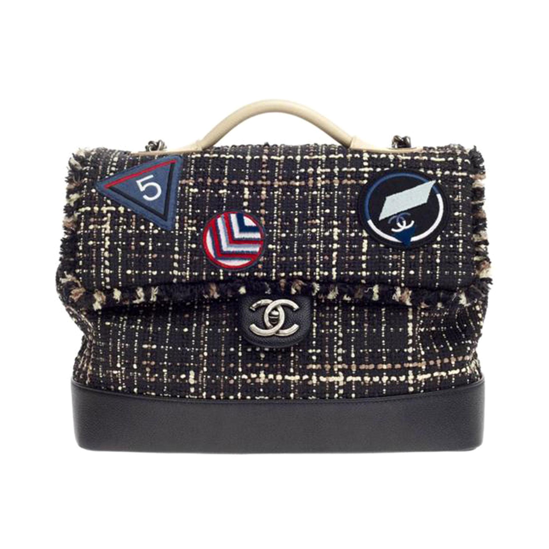 Chanel Grained Calfskin Tweed Crest Airline Runway Top Handle Flap Bag

2016 Act II Collection
Ruthenium hardware
CC turn-lock closure at front flap
Black, creme and multicolor tweed
Rolled top handle
Chain with shoulder pad
Slip pocket at back with