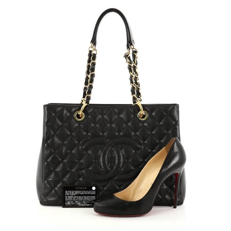 This authentic Chanel Grand Shopping Tote Quilted Caviar is perfect for everyday use with a classic yet luxurious style. Crafted in black diamond quilted caviar leather, this versatile timeless tote features woven-in leather chain straps with