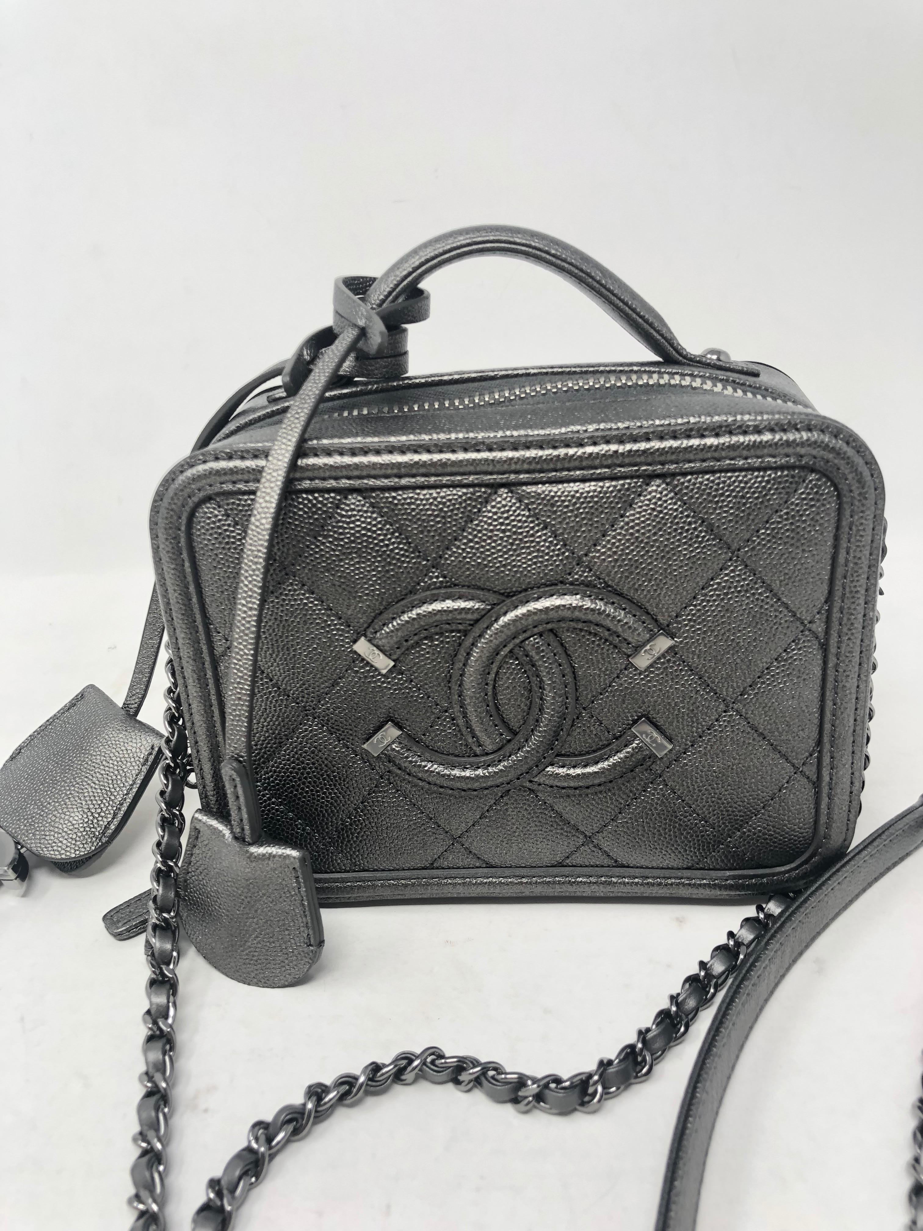 Chanel Gray Metallic Small Vanity Case Crossbody Bag. CC Filigree Caviar leather. Antique silver hardware. Small size vanity crossbody. Rare and limited bag. Brand new condition. Includes authenticity card and dust cover. Guaranteed authentic. 