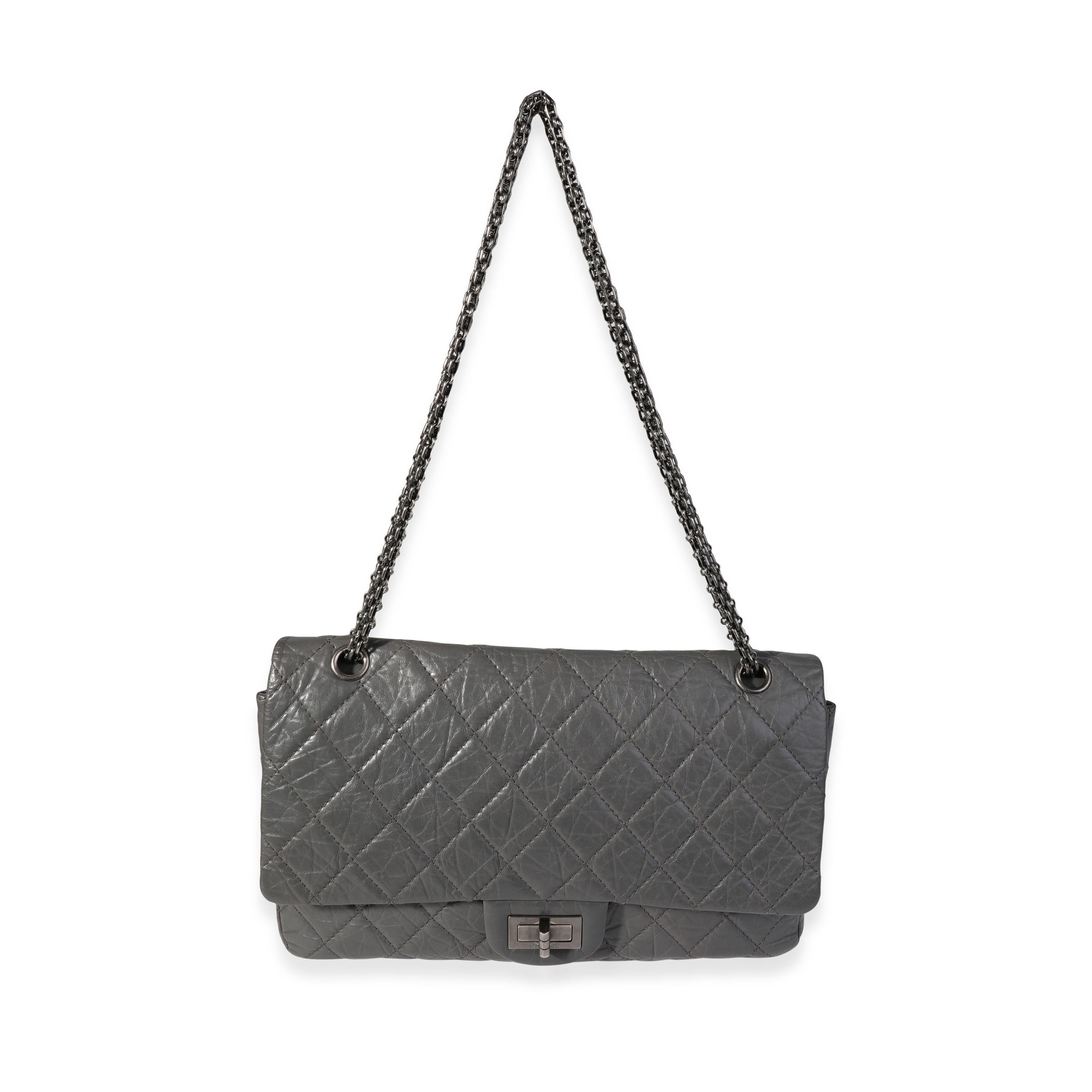 Listing Title: Chanel Gray Quilted Aged Calfskin Reissue 2.55 227 Double Flap Bag
SKU: 121120
Condition: Pre-owned 
Handbag Condition: Very Good
Condition Comments: Very Good Condition. Light scuffing to corners. Light scuffing and discoloration at