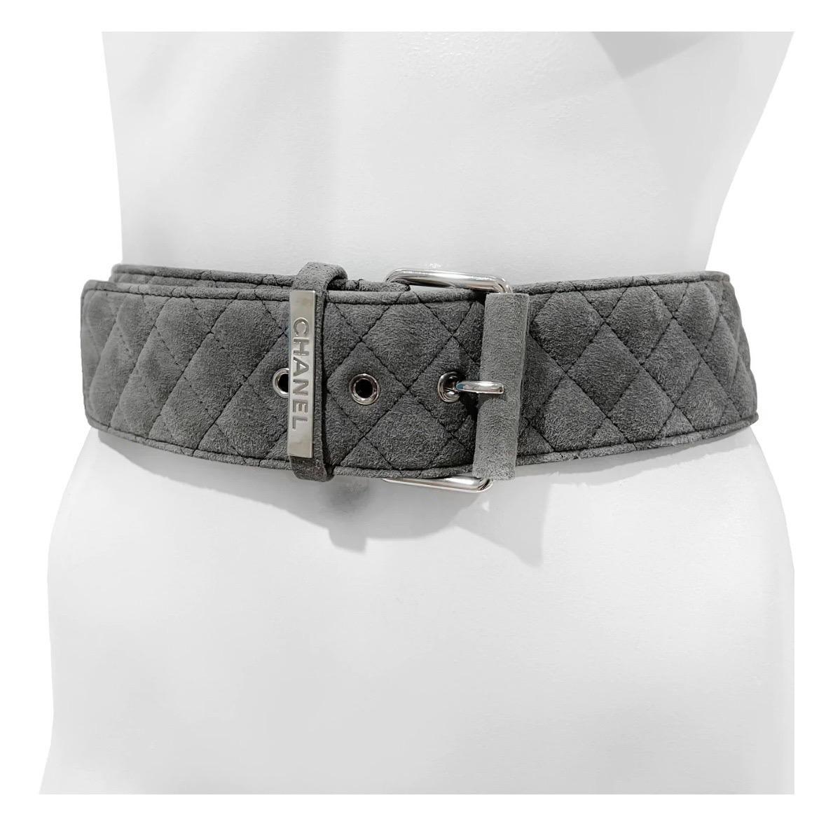 Quilted Suede Belt by Chanel
Fall 2011
Made in Italy 
Gray
Three holes for belt adjusting 
Excellent Condition; Preloved with little to no visible signs of wear or use throughout belt. 
Size/Measurements: (approximate)
Size 40
3/16