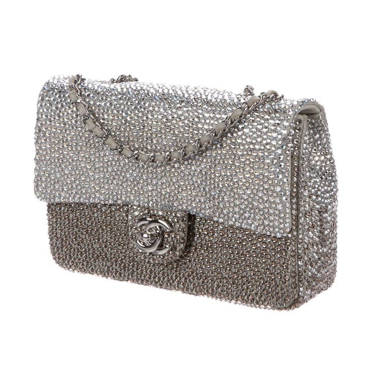 Suede 
Crystal
Silver-tone hardware
Suede and satin lining
Turn-lock closure
Shoulder strap drop 18