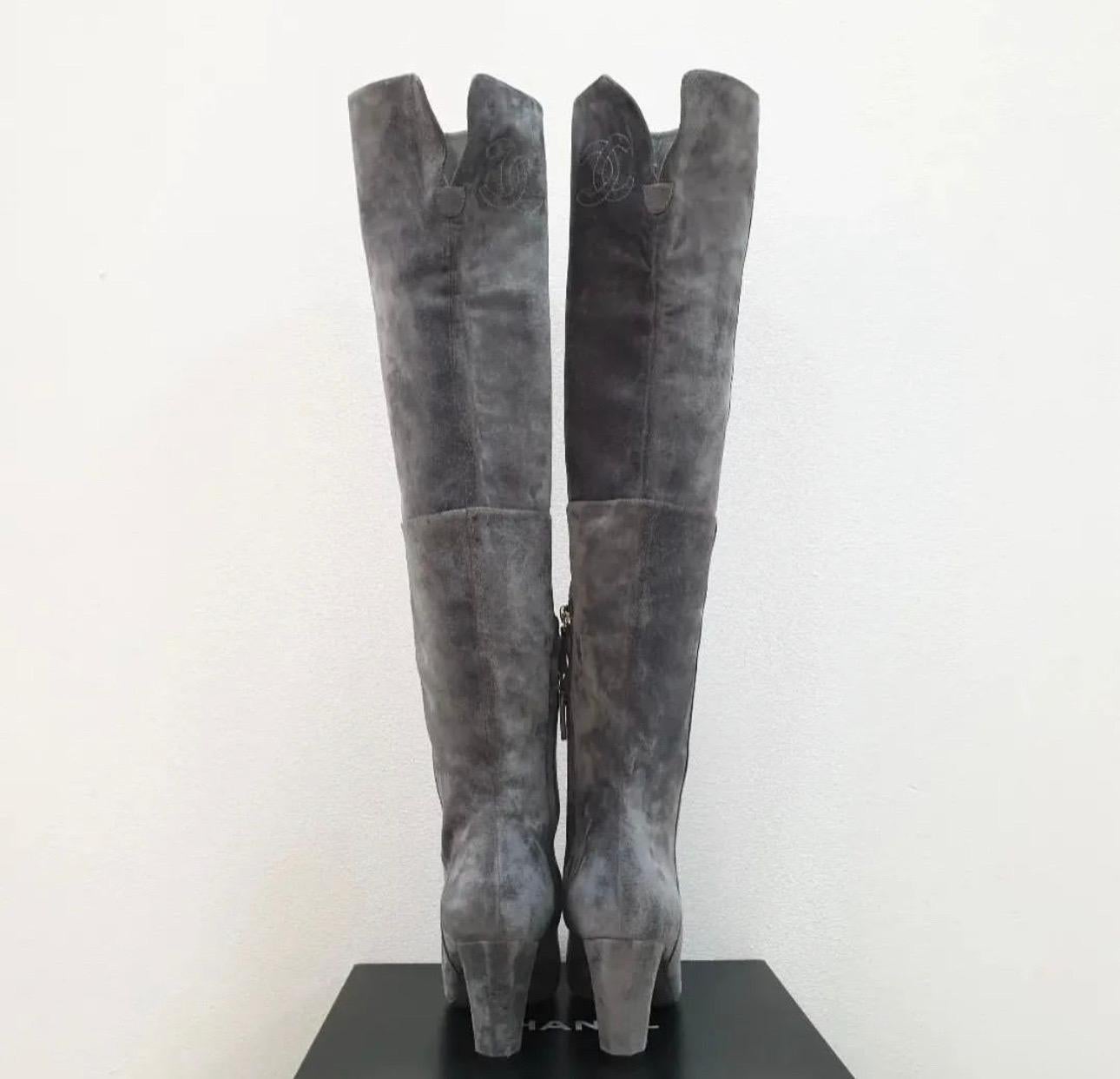 CHANEL gray suede over the knee boots from the 13B collection,  
Grey suede with cap toe detail; covered hexagonal heels. 
Pull on style with lower inner half zip; large interlocking CC embroidery at the inner toplines.
Sz.38
No original packaging.
