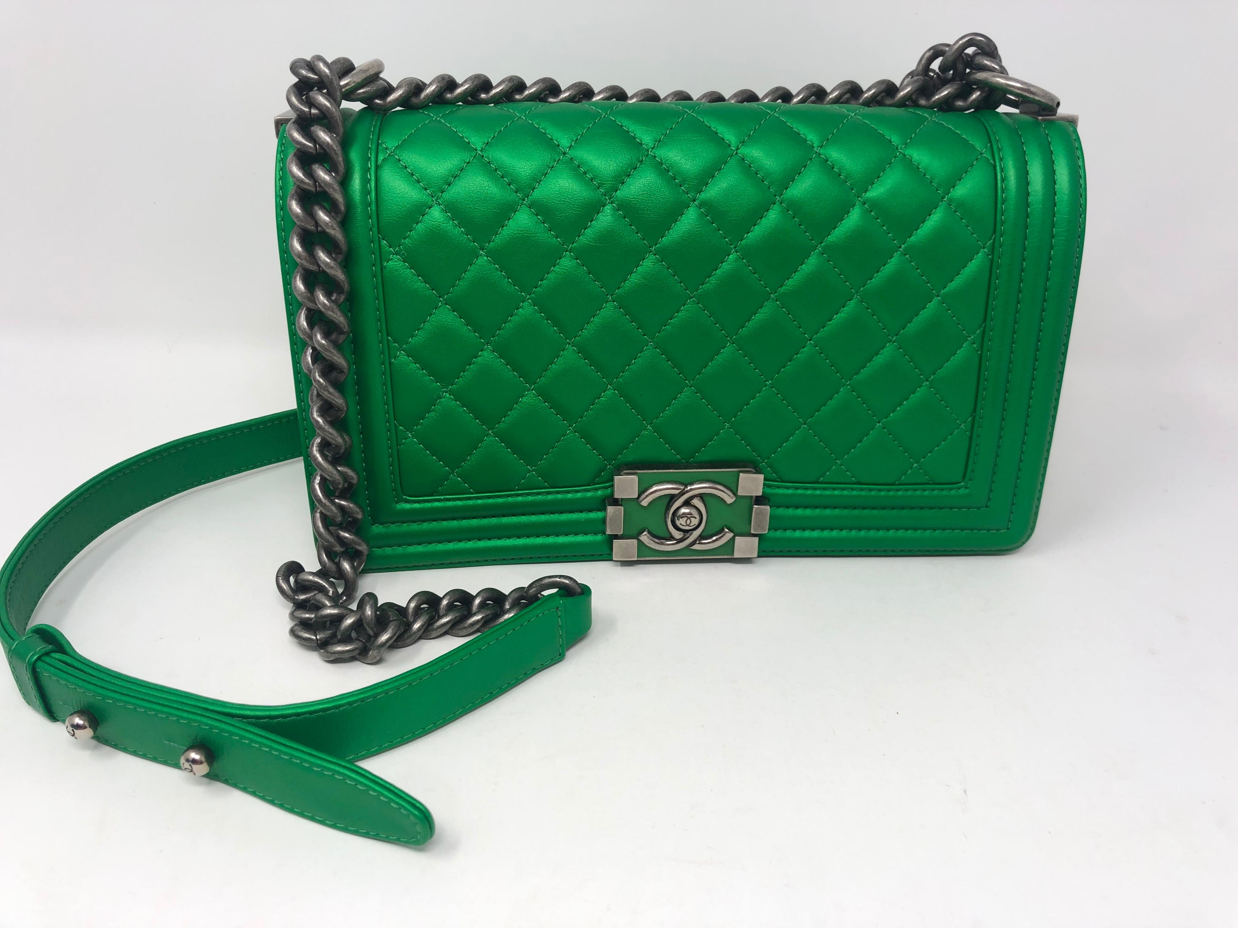 Chanel Metallic Green Boy Bag. Excellent condition. Only has a light scratch on bottom of bag. Please see photos. Rare color Chanel bag. Medium size bag. Ruthenium hardware. Can be worn crossbody or doubled as a shoulder bag. Guaranteed authentic. 