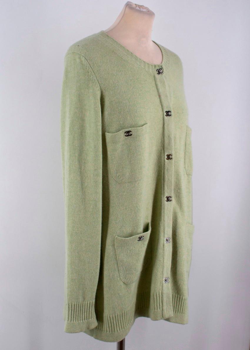  Chanel Green Cashmere Cardigan

-Green cardigan with silver tone hardware
-Four front pockets
-Silver tone 'CC' clasp closure
-Ribbed cuffs, hemline and collar
-Scoop neckline

Please note, these items are pre-owned and may show signs of being