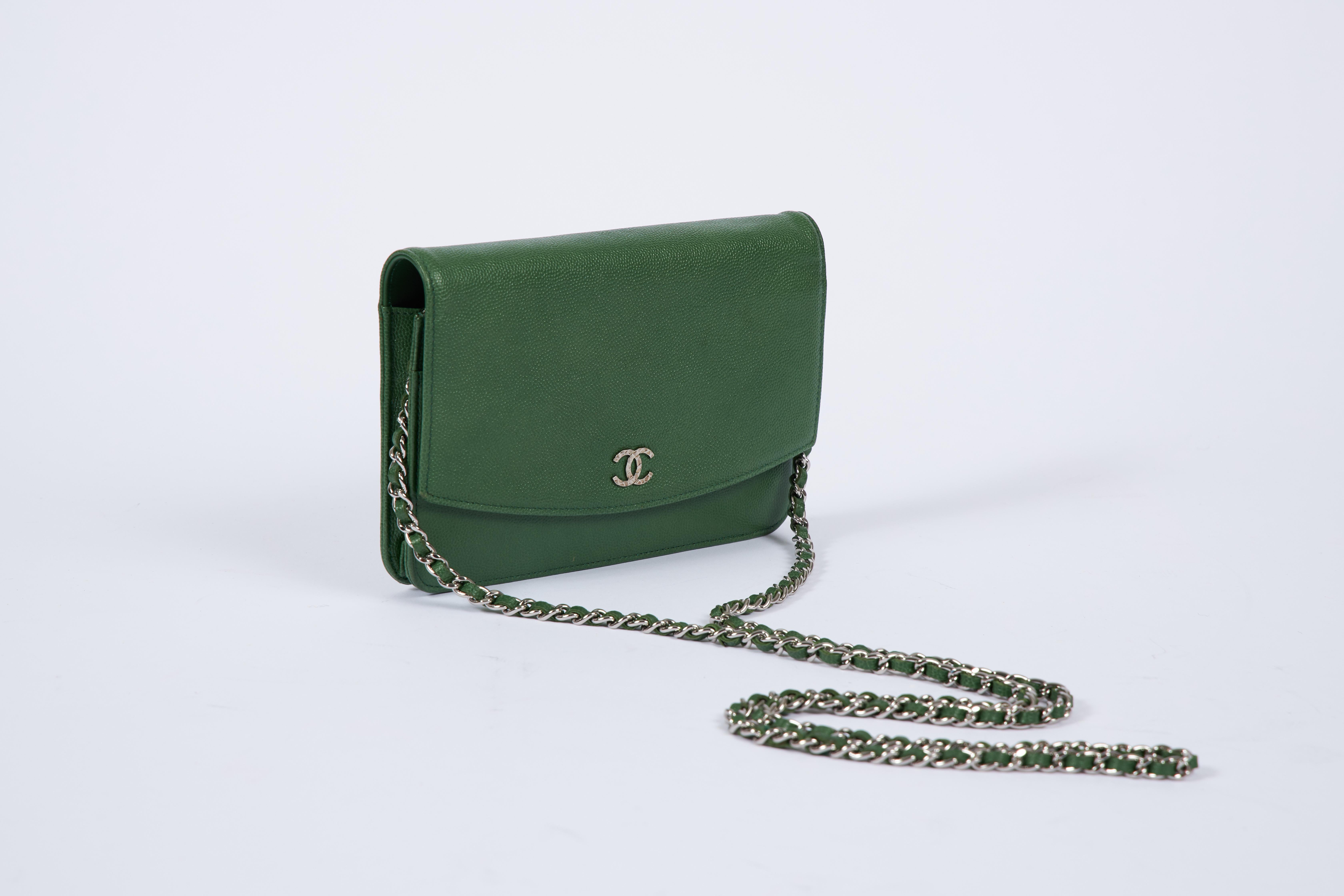 Chanel emerald green caviar wallet on a chain cross body bag. Comes with hologram and original box.