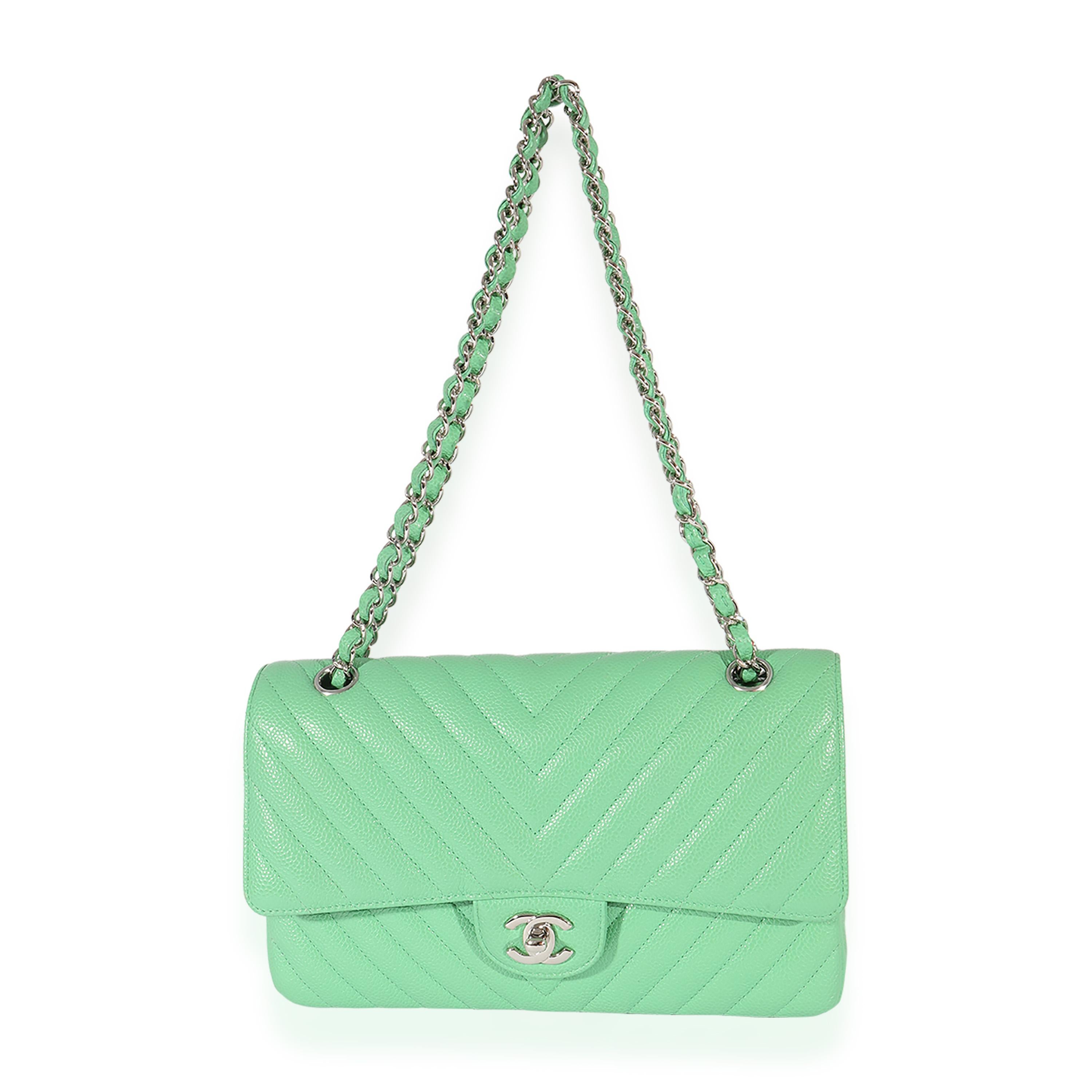 Listing Title: Chanel Green Chevron Quilted Caviar Medium Classic Flap Bag
SKU: 125071
MSRP: 8800.00
Condition: Pre-owned 
Handbag Condition: Very Good
Condition Comments: Very Good condition. Exterior corner scuffing and discoloration throughout.