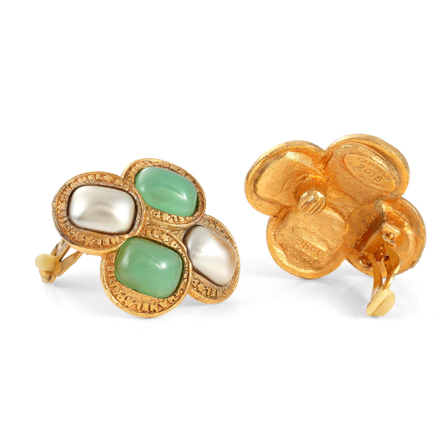 These authentic Chanel Green Gripoix and Pearl Earrings are in exceptionally good vintage condition from the late 80’s- early 90’s.  Seafoam green Gripoix glass stones are beautifully complemented by silver toned faux pearls.  Positioned in gold