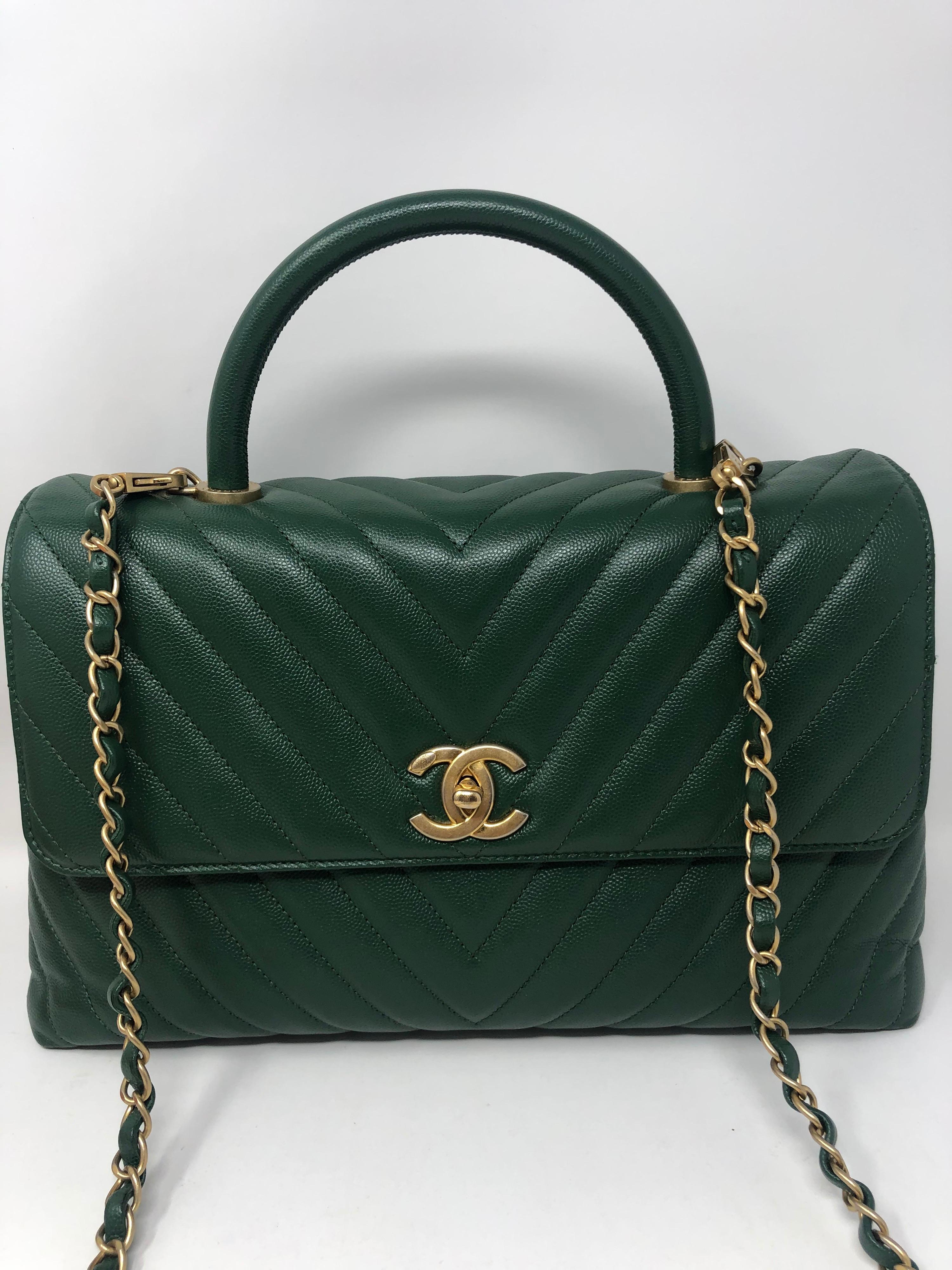 Chanel Green Chevron Coco Handle Bag. Gold hardware. Large size Coco Handle. Rare color and limited. Excellent condition like new. Can be worn 2 ways. Includes original tag and authenticity card. Don't miss out. Guaranteed authentic. 
