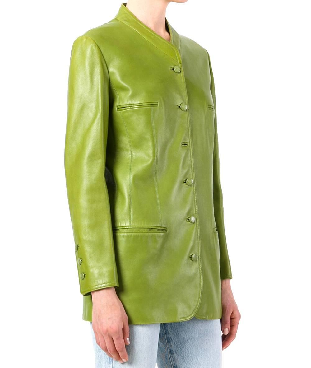 Lively green leather jacket from Chanel. It features a shawl collar, a front button fastening, two chest pockets, two front pockets, long sleeves, button cuffs and a straight hem. The item is vintage, it was produced in the 90s and is in very good