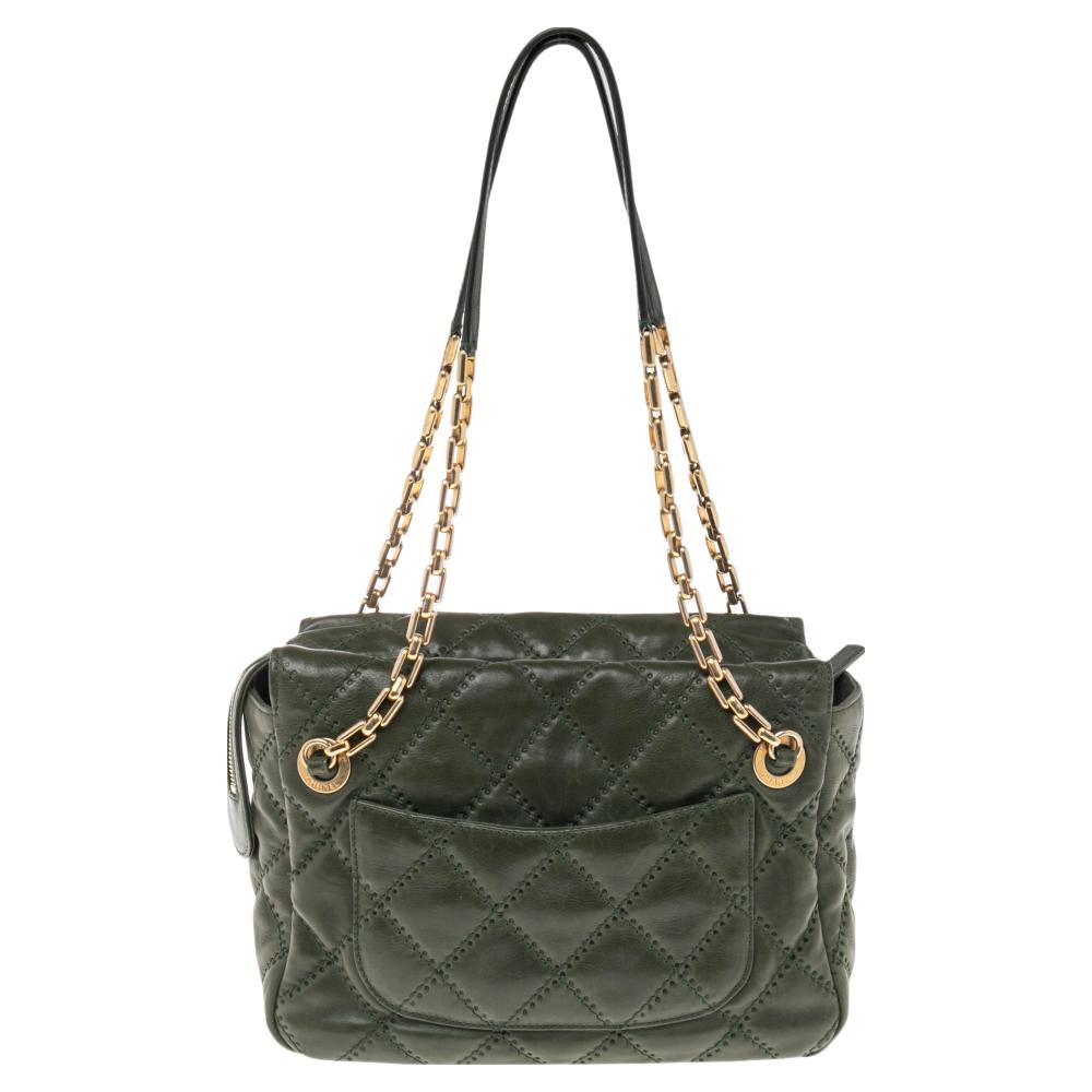 This Chanel bag has it all! From the green quilted leather exterior to the roomy interior and the CC logo at the front, this bag will definitely redefine what you think of a day bag. The fabric-lined interior is spacious and has pockets. This bag is