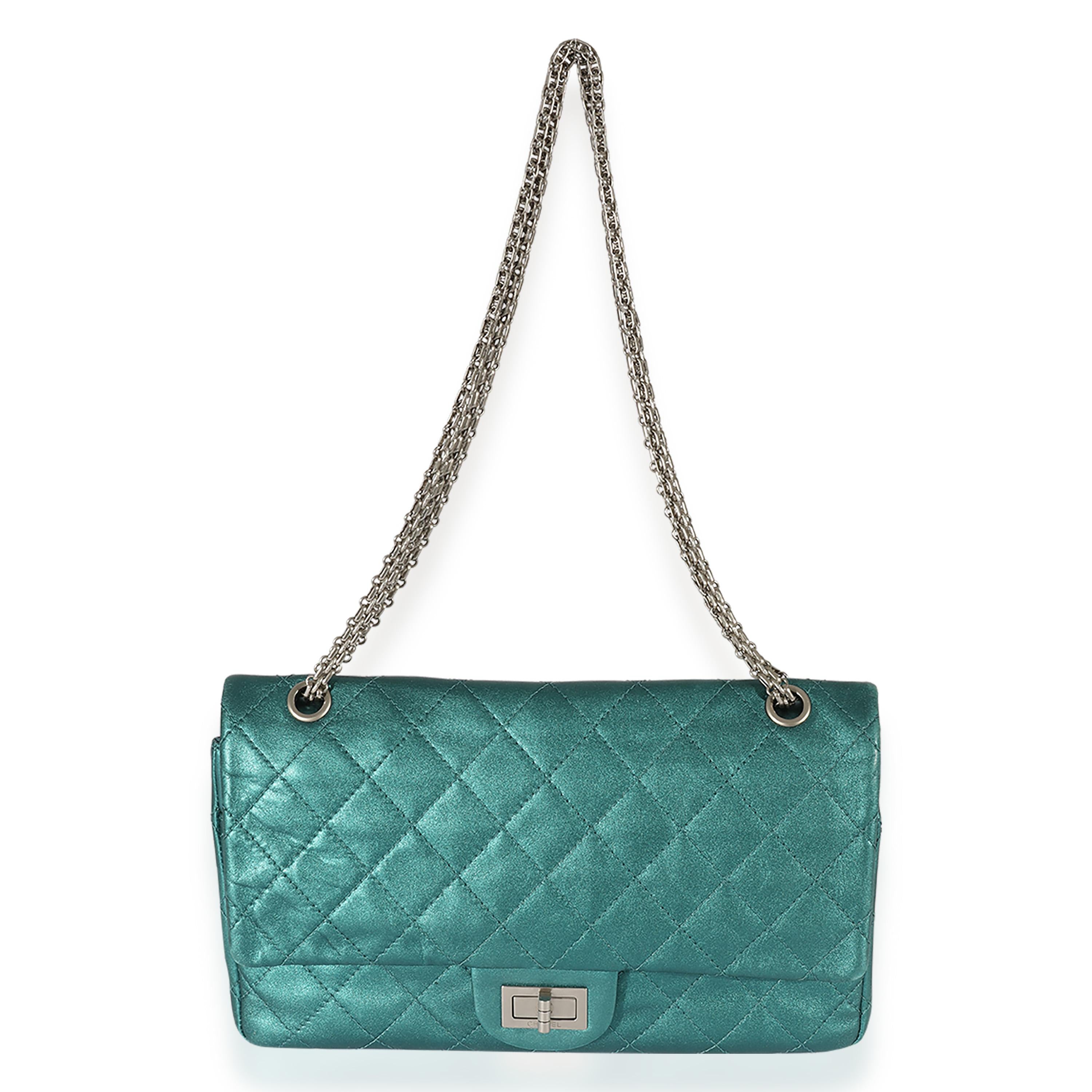 Listing Title: Chanel Green Metallic Leather 2.55 227 Reissue Flap Bag
SKU: 126500
Condition: Pre-owned 
Condition Description: In 2005, Karl Lagerfeld reintroduced the original 2.55 design from Chanel. The quilted flap bag comes in an aged calfskin