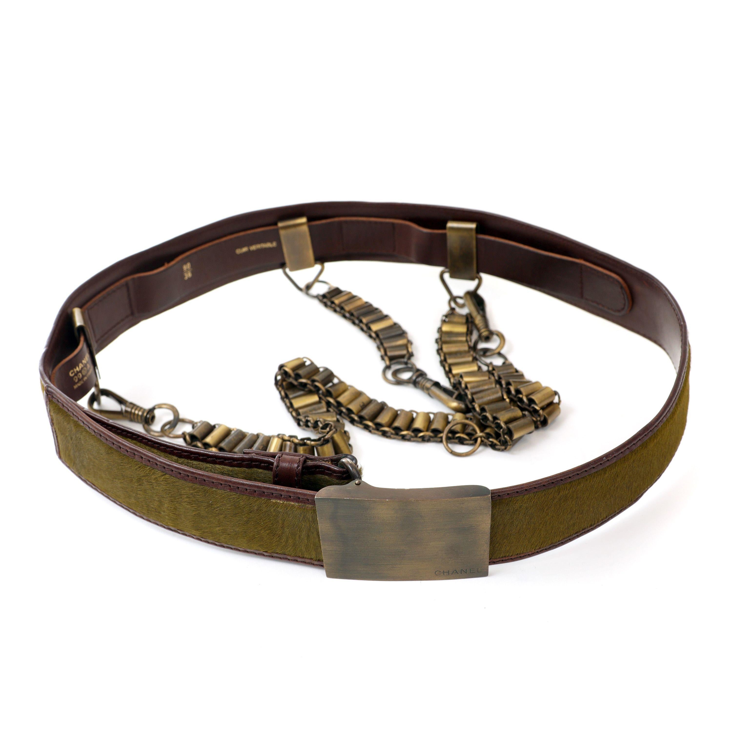 This authentic Chanel Green Pony Hair and Draped Chains Runway Belt is in excellent plus condition.  Extremely rare and collectible, this unique piece combines leather, metals and pony hair for maximum impact.

PBF 13138