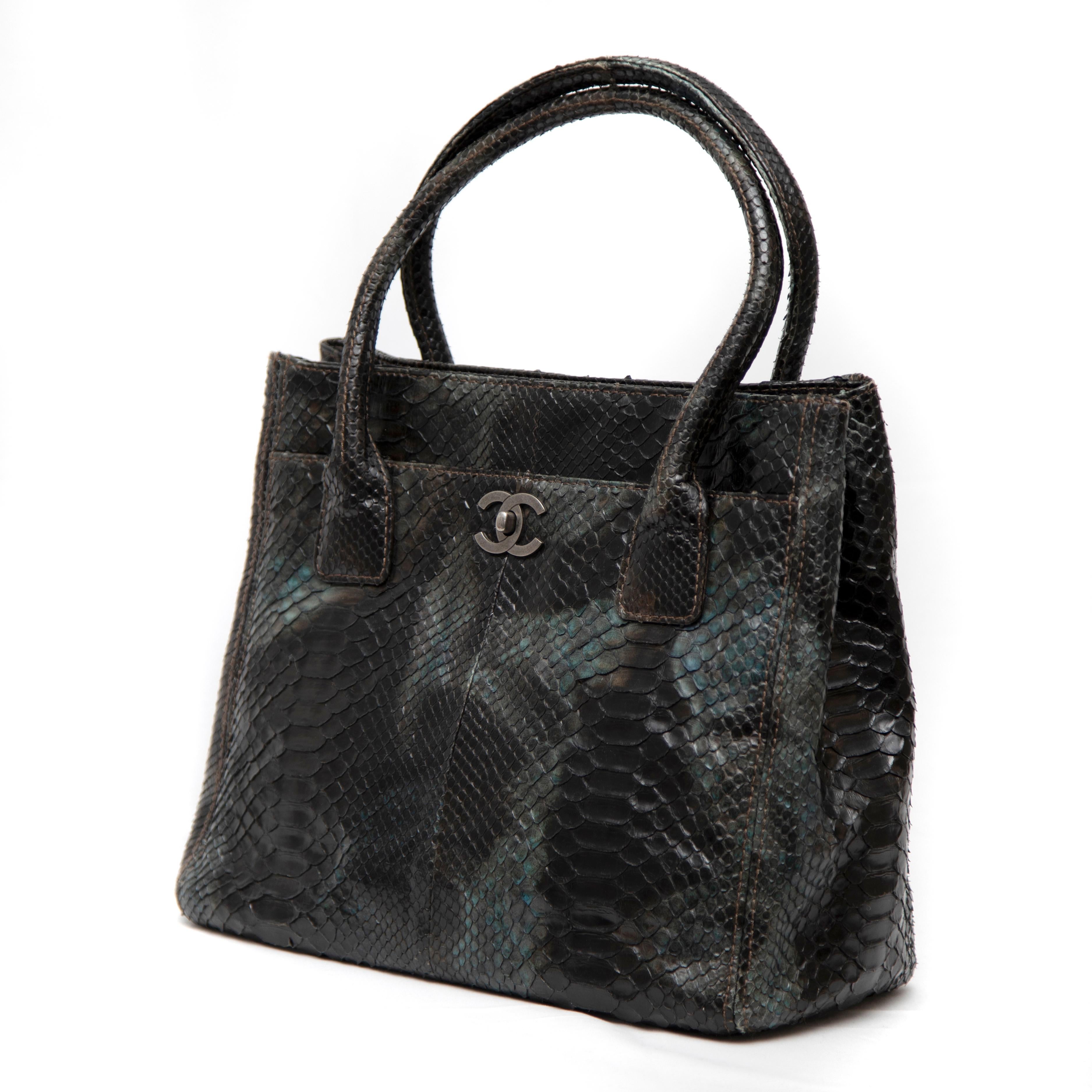 The Green Python Medium Executive Cerf Tote is a luxurious and sophisticated handbag that beautifully combines exotic materials with timeless design. Crafted from premium green python leather, this tote showcases a stunning sheen and a unique