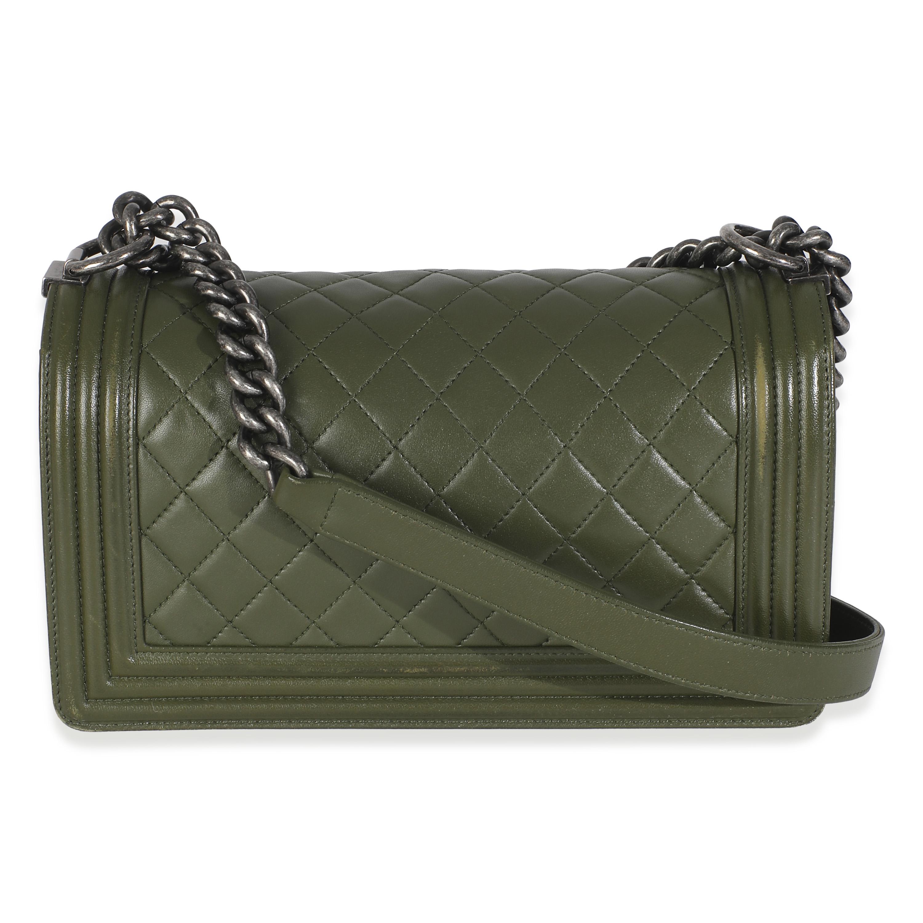 Listing Title: Chanel Green Quilted Lambskin Old Medium Boy Bag
SKU: 146222
Condition: Pre-owned 
Condition Description: An instant classic, the Boy bag from Chanel was introduced in 2011. The quilted bag was designed by the late Karl Lagerfeld, who