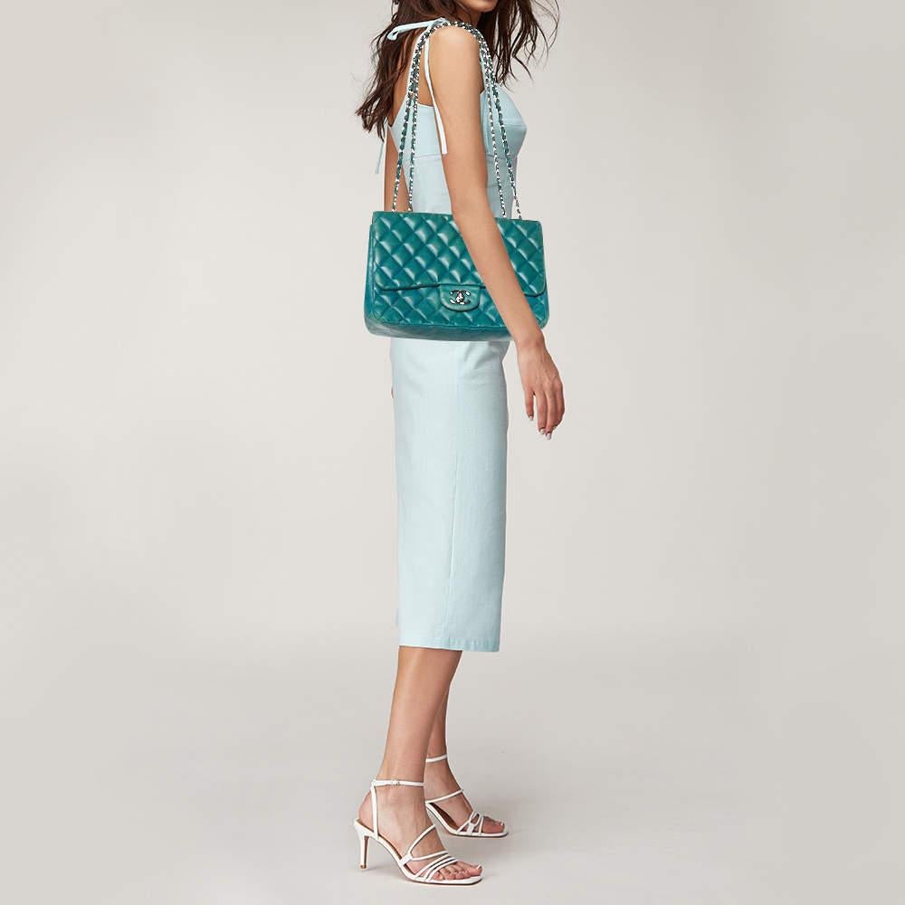 Chanels luxurious Classic Flap bag is a must have in a well curated wardrobe This stunning bag has a masterfully crafted leather exterior with silver tone hardware and the iconic CC logo on the front. This Jumbo Classic Double Flap is complete with